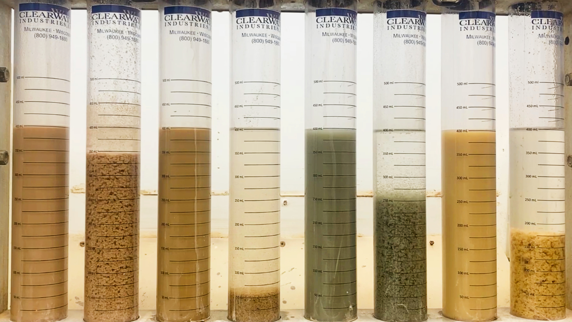 A polymer jar test picture with many different slurries being tested to show how different slurries react to polymer dosing.