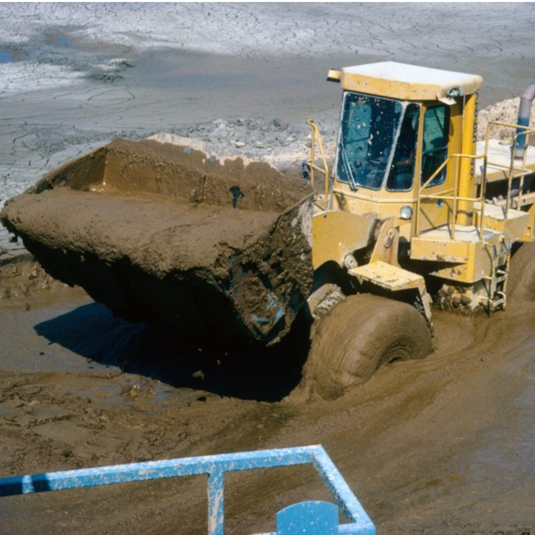 Loader excavating sand and gravel 