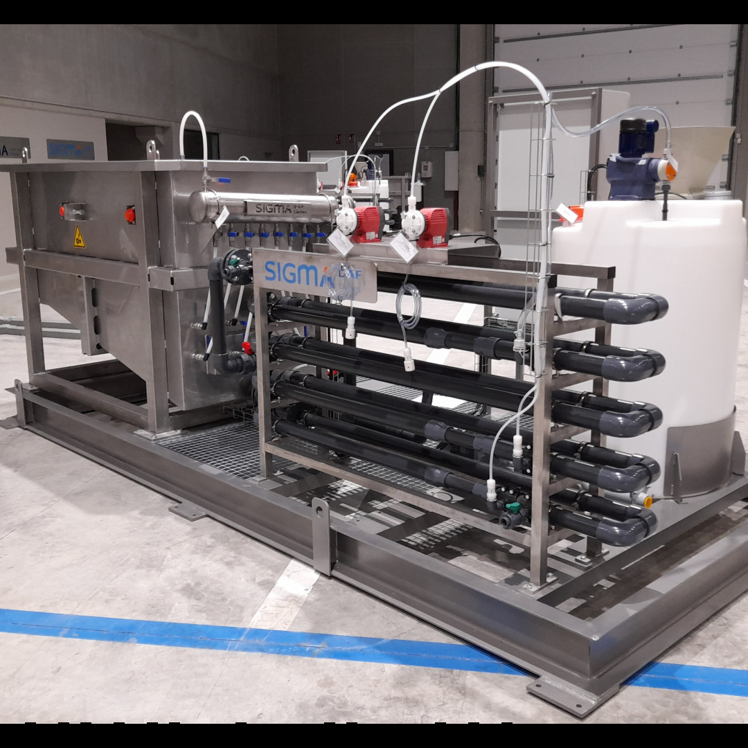 A single skid DAF clarifier system with PVC pipes, plastic tubes, plastic tanks, and stainless steel clarifier on one skid.